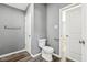 Simple bathroom with a toilet and door at 1418 S New Jersey St, Indianapolis, IN 46225