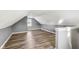 Spacious bonus room with sloped ceilings and wood flooring at 1418 S New Jersey St, Indianapolis, IN 46225
