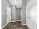 Gray entryway with wood-look flooring and storage at 1418 S New Jersey St, Indianapolis, IN 46225