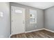 Bright entryway with white door and gray walls at 1418 S New Jersey St, Indianapolis, IN 46225