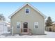 Gray house with wooden steps and snowy yard at 1418 S New Jersey St, Indianapolis, IN 46225