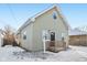 Gray house with wooden steps and snowy yard at 1418 S New Jersey St, Indianapolis, IN 46225