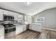 Modern kitchen with stainless steel appliances and white cabinets at 1418 S New Jersey St, Indianapolis, IN 46225
