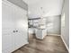 Modern kitchen with stainless steel appliances and white cabinets at 1418 S New Jersey St, Indianapolis, IN 46225