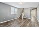 Gray living room with wood-look floors at 1418 S New Jersey St, Indianapolis, IN 46225