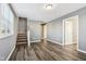Spacious living room with gray walls and staircase at 1418 S New Jersey St, Indianapolis, IN 46225