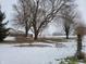 Snowy backyard with a view of the house and farm at 1545 S Us 421, Zionsville, IN 46077