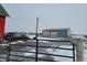 Property with two barns, one red and one gray, a truck, and a gate in the winter at 1545 S Us 421, Zionsville, IN 46077