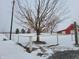 Red barn with white fence in snowy landscape at 1545 S Us 421, Zionsville, IN 46077