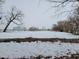 Open snowy farm field with barn in background at 1545 S Us 421, Zionsville, IN 46077