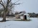 Small white shed with open door in snowy yard at 1545 S Us 421, Zionsville, IN 46077