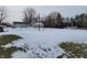 One story ranch house with attached garage, viewed from the yard in the winter at 1545 S Us 421, Zionsville, IN 46077