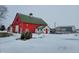 Red barn with green roof and snow on ground at 1545 S Us 421, Zionsville, IN 46077