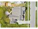 Aerial view of a home showcasing the roof, backyard, outdoor fire pit, landscaping, and long driveway at 15844 Nocturne Dr, Westfield, IN 46074