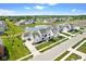 An aerial view of a luxurious neighborhood with a pond and beautifully landscaped yards at 15844 Nocturne Dr, Westfield, IN 46074