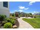 Backyard patio with a fire pit, seating, stone walkway, and lush landscaping providing a relaxing outdoor space at 15844 Nocturne Dr, Westfield, IN 46074