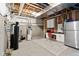Unfinished basement with exposed ceiling, utilities, storage, and a workstation with built-in cabinets at 15844 Nocturne Dr, Westfield, IN 46074