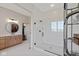 Modern bathroom featuring a glass-enclosed shower and vanity with double sinks at 15844 Nocturne Dr, Westfield, IN 46074