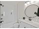 Bright bathroom featuring a shower with glass enclosure, a white vanity, and modern fixtures at 15844 Nocturne Dr, Westfield, IN 46074