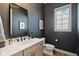 Modern half bathroom with stylish fixtures, a vanity with ample storage, and a sleek design at 15844 Nocturne Dr, Westfield, IN 46074