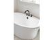 Elegant freestanding bathtub with modern matte black fixtures at 15844 Nocturne Dr, Westfield, IN 46074