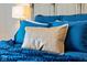 Comfortable bedroom with plush bedding, throw blanket, and stylish decorative pillows at 15844 Nocturne Dr, Westfield, IN 46074