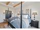 Bedroom featuring a four-poster bed, wood floors, and bright natural light at 15844 Nocturne Dr, Westfield, IN 46074