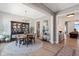 Elegant dining room featuring a large table, stylish chandelier, and built-in china cabinet at 15844 Nocturne Dr, Westfield, IN 46074