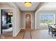 Inviting foyer with hardwood floors and natural light, leading to the dining and office areas at 15844 Nocturne Dr, Westfield, IN 46074