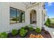 Charming brick archway and a front entry with manicured landscaping at 15844 Nocturne Dr, Westfield, IN 46074