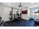 Well-equipped home gym featuring weightlifting equipment, a stationary bike, and a treadmill at 15844 Nocturne Dr, Westfield, IN 46074