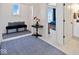 Hallway leading to a bedroom and a bathroom, featuring carpet and elegant decorative touches at 15844 Nocturne Dr, Westfield, IN 46074