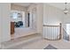 Upper hallway with gray carpet, a decorative railing, and an open view into a cozy seating area at 15844 Nocturne Dr, Westfield, IN 46074