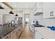 Spacious kitchen with stainless steel appliances, ample counter space, and a view into the dining area at 15844 Nocturne Dr, Westfield, IN 46074