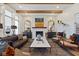 Bright and airy living room featuring a fireplace, hardwood floors, and modern furnishings at 15844 Nocturne Dr, Westfield, IN 46074