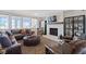 Beautiful living room features a fireplace, large windows, plush furniture and stylish decor at 15844 Nocturne Dr, Westfield, IN 46074
