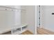 Mudroom showcasing beadboard wainscoting, coat hooks, bench seating, and built-in storage cubbies at 15844 Nocturne Dr, Westfield, IN 46074