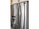 Modern stainless steel refrigerator with a water dispenser, offering convenience and a sleek look at 15844 Nocturne Dr, Westfield, IN 46074