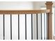Modern staircase railing with wood accents and sleek black metal spindles at 15844 Nocturne Dr, Westfield, IN 46074