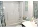 Clean bathroom with tub shower, vanity, and decorative accents at 173 Megan Way, Cumberland, IN 46229