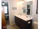 Bathroom with double vanity, large mirror, and shower at 173 Megan Way, Cumberland, IN 46229