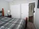 Bedroom with a queen bed, double door closet and access to another room at 173 Megan Way, Cumberland, IN 46229