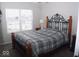 Bedroom with a queen bed, nightstands, and ceiling fan at 173 Megan Way, Cumberland, IN 46229