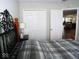 Bedroom with a queen bed, double door closet and access to another room at 173 Megan Way, Cumberland, IN 46229