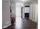Spacious entryway with wood-look floors, bench, and access to other rooms at 173 Megan Way, Cumberland, IN 46229