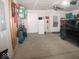 Spacious garage with car, storage, and ceiling fan at 173 Megan Way, Cumberland, IN 46229