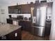 Modern kitchen with granite countertops and stainless steel appliances at 173 Megan Way, Cumberland, IN 46229