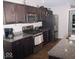 Modern kitchen with granite countertops and stainless steel appliances at 173 Megan Way, Cumberland, IN 46229