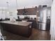 Modern kitchen with granite countertops and stainless steel appliances at 173 Megan Way, Cumberland, IN 46229