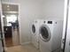 Laundry room with washer, dryer, and access to other areas at 173 Megan Way, Cumberland, IN 46229